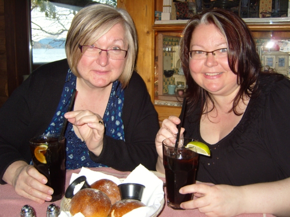Ella and Annie with cokes and pretzel rolls at the Gasthaus in Peachland, BC